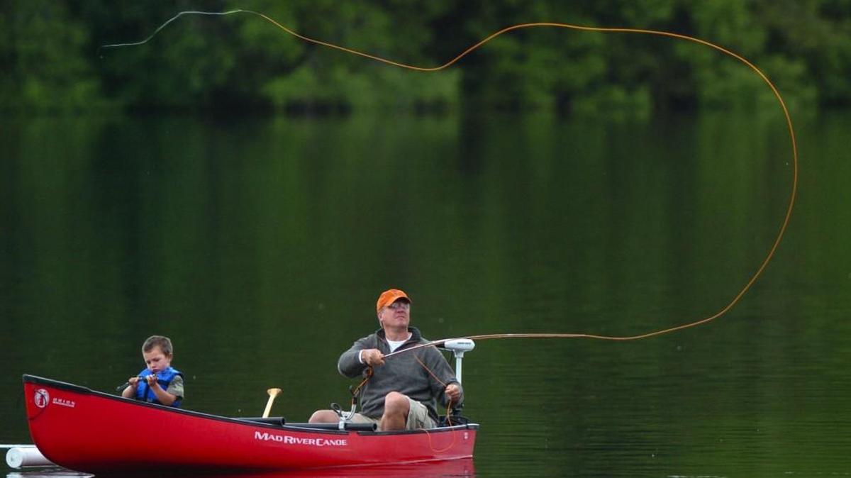 Robert Brown of Olympia casts his line over Offut Lake in 2011.