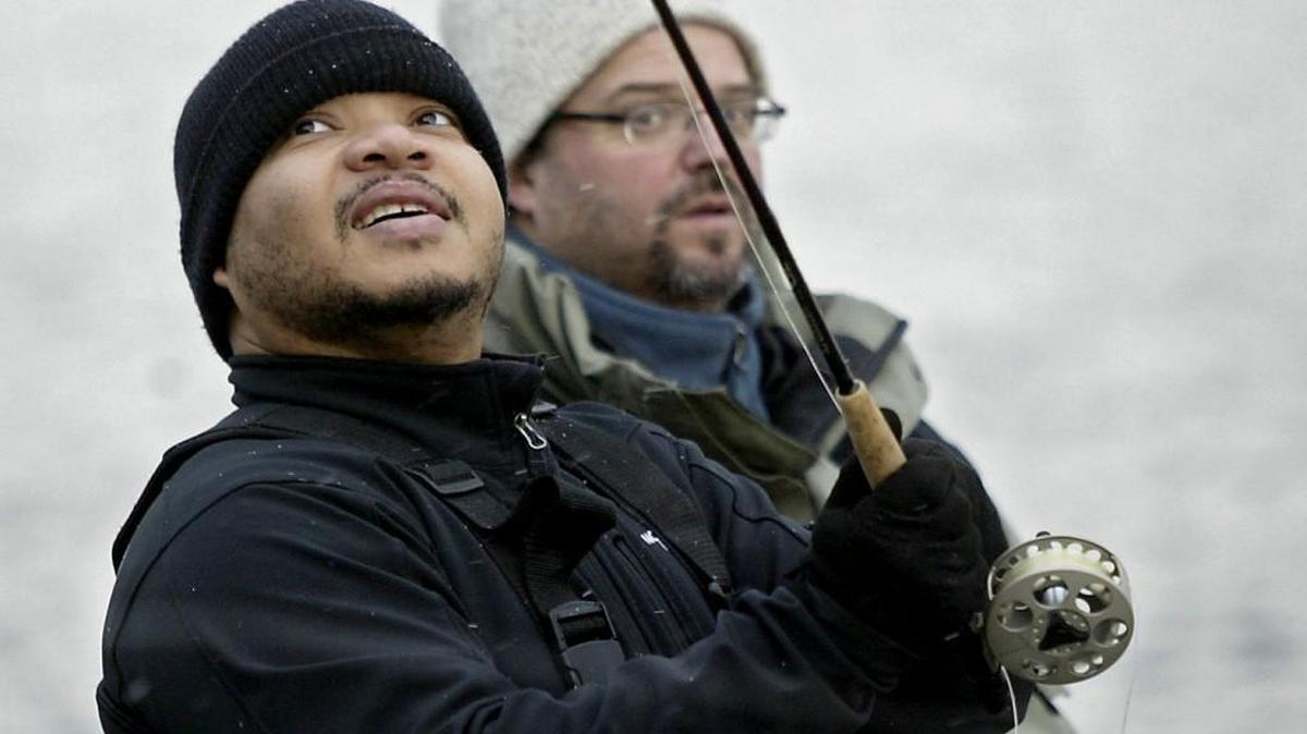 Former TNT reporter Earnest Jasmine gets a lesson on the fundamentals of fly fishing from outdoors reporter Jeff Mayor on a snowy day near Titlow Beach.