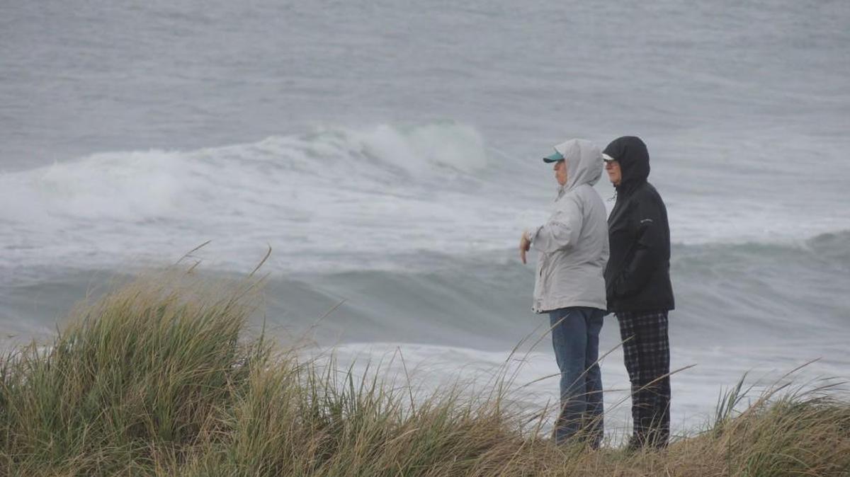 A bluff above the beach near Westport makes a good, but windy viewpoint to watch storm-driven waves crash ashore.