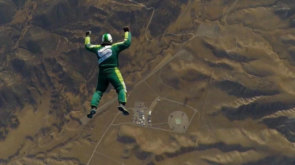 Luke Aikins of Shelton free falls toward a 100-by-100-foot net in Simi Valley, California. He jumped without a parachute from a plane at 25,000 feet on July 30.