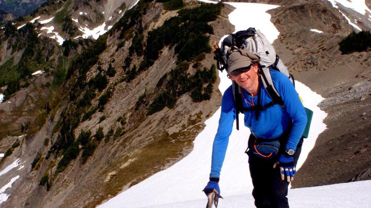 Steve McClure, climbing in the Bailey Range, wants people to embrace modern wilderness navigation tools.
