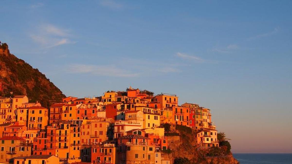 
The village of Manarola, Italy glows in the light as the sun sets in May 2015.
