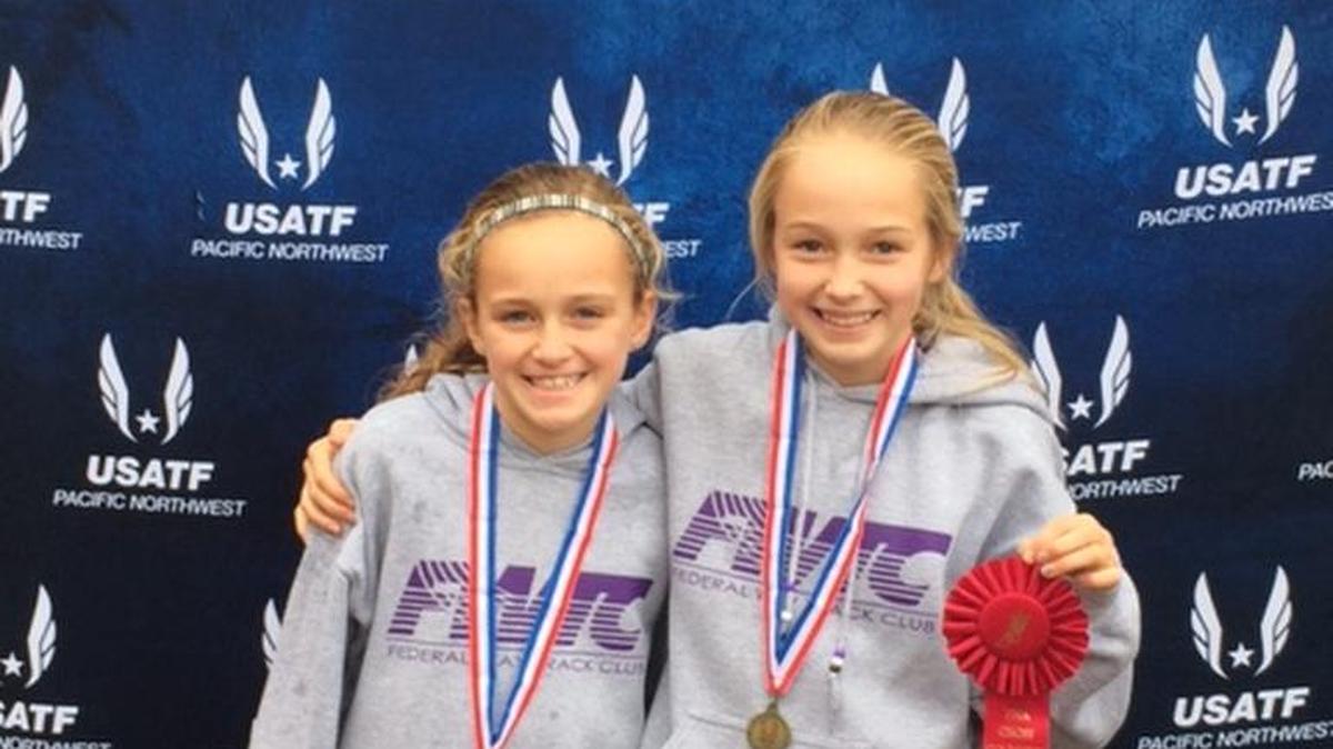 Ava (left) and Ella Borsheim of Tacoma and the Federal Way Track Club say they inspire each other.
