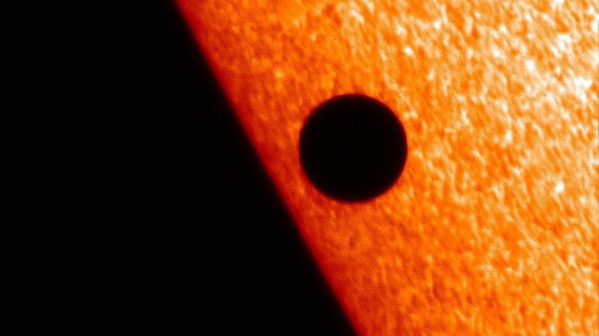 This image from NASA’s Hinode X-ray telescope shows Mercury in transit across the face of the sun in November 2006. There will be another transit by Mercury on Monday morning.