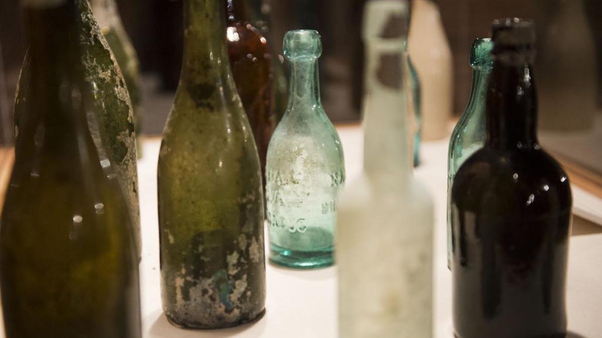 
Old saloon bottles found in the ground are displayed in a case as visitors learn about Sacramento history  on an Old Sacramento Underground Tour.
