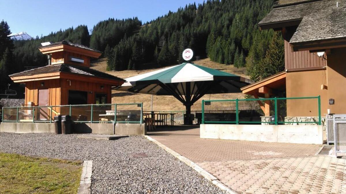A large umbrella capable of covering more than 150 seats is a new addition to the day lodge sundeck at Crystal Mountain Resort.