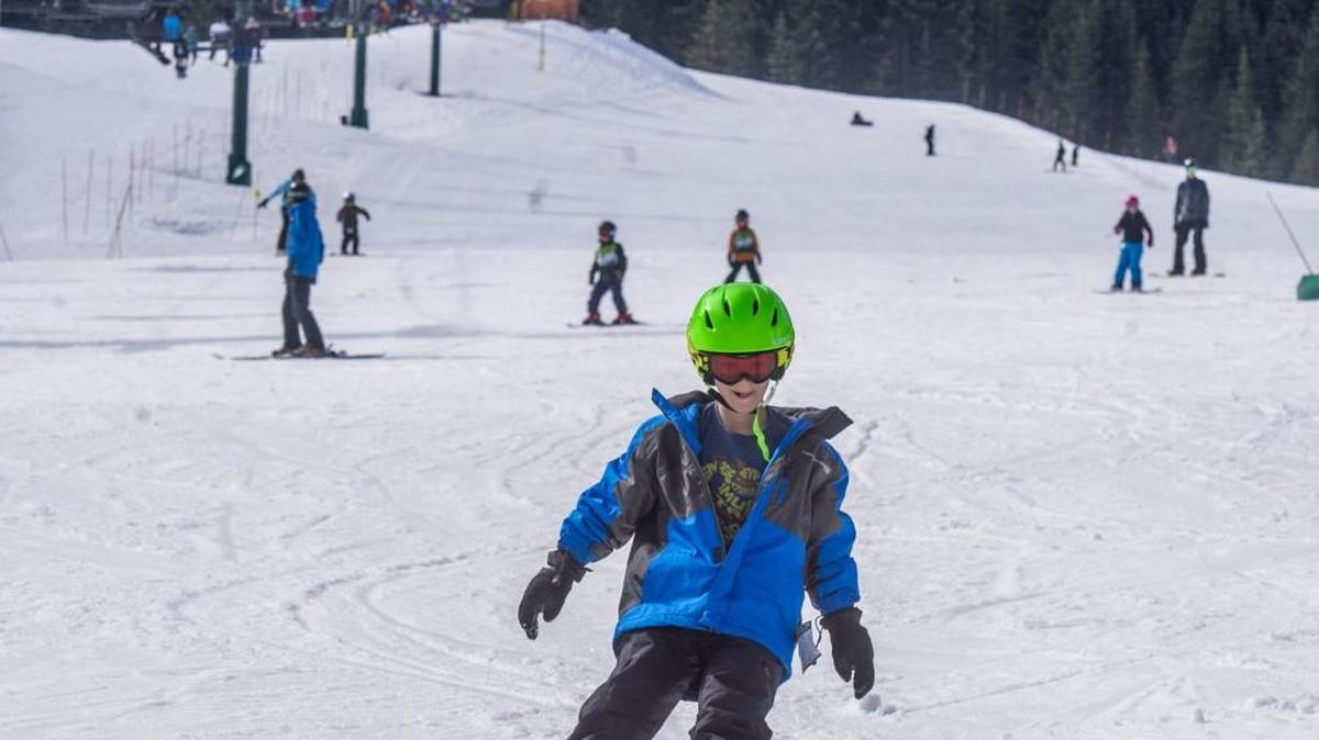 Beginning skiers and boarders swarm the bunny slope on a warm and sunny April 1 at Crystal Mountain.