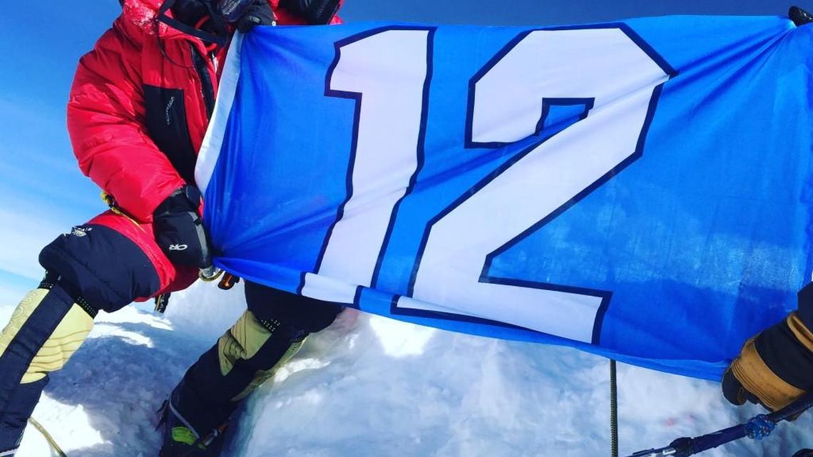 Olympia’s Josh McDowell of International Mountain Guides carried a 12th Man flag to the top of Mount Everest.