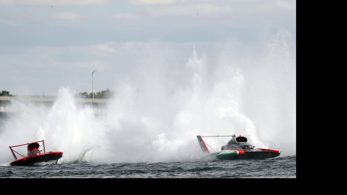 
Jimmy Shane, in the U-1 Oberto, right, moves past J. Michael Kelly, in the U-5 Graham Trucking, after turn two on the Columbia River on Sunday during the final lap of the HAPO APBA Gold Cup race in Kennewick. Shane won the Gold Cup. 
