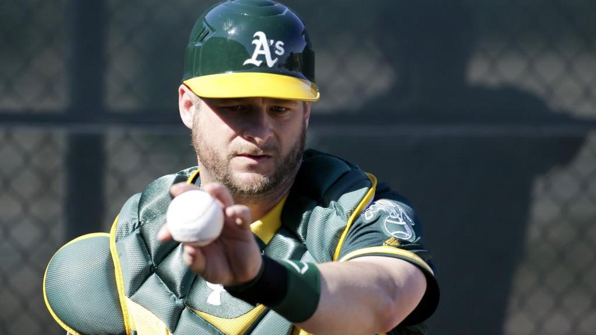 Oakland Athletics catcher Stephen Vogt works on a drill during a spring baseball practice in Mesa, Ariz., Sunday, Feb. 21, 2016.