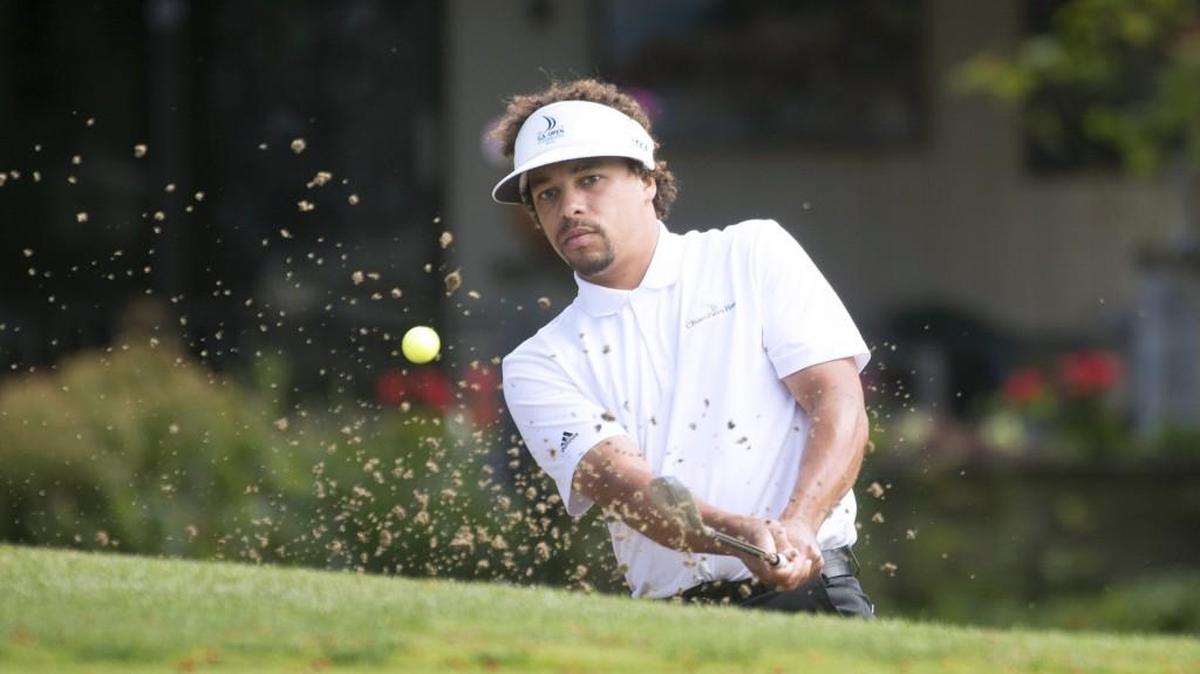 Defending champion Casey Adams hits from the bunker on the par 5 14th hole during the opening day of the Capitol City Amateur tournament at Capitol City Golf Club in Lacey on Saturday, June 11, 2016. The event concludes Sunday.