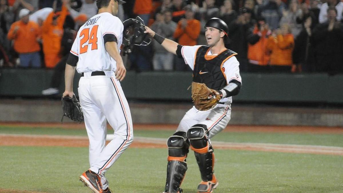 Oregon State catcher Logan Ice congratulates pitcher Scott Schultz, left, after after the team defeated UC Irvine in an NCAA college baseball regional tournament game in Corvallis, Ore., Sunday, June 1, 2014.