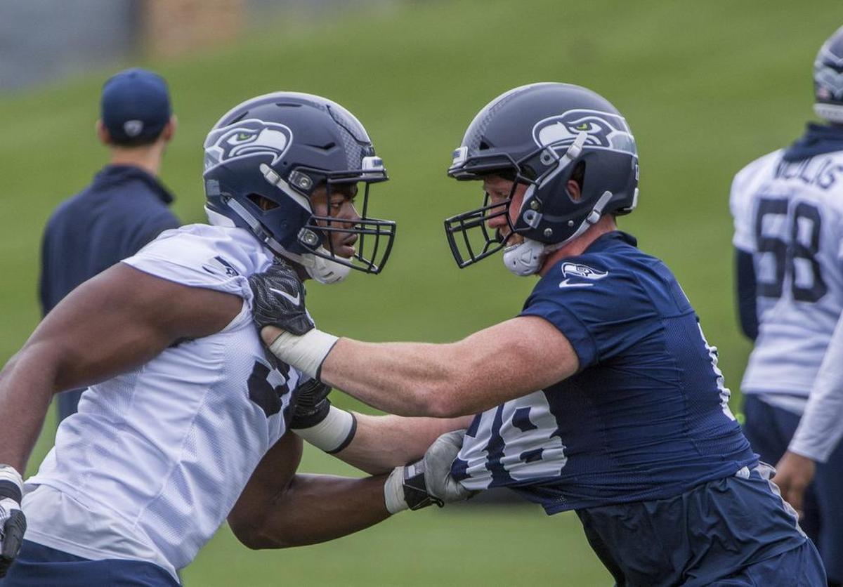 Fellow rookie Rasheem Green (left) is just one of the guys rookie tight end Will Dissly, a former University of Washington defensive lineman, has taken on in his first months and weeks with the Seahawks. Dissly is impressing teammates and coaches with his all-around game.