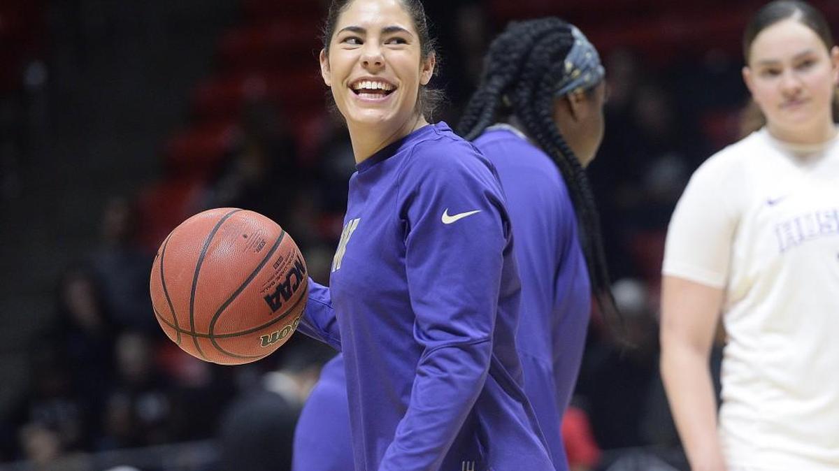 Washington guard Kelsey Plum smiles as she jokes with teammates before a game against Utah on Feb. 3. Plum is leading the nation in scoring and help lead the No. 12-ranked Huskies to a 27-5 overall record this season.