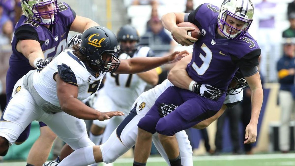 
Washington quarterback Jake Browning (3) gets tackled by California’s Kyle Kragen for one of the Golden Bears’ five sacks Saturday.
