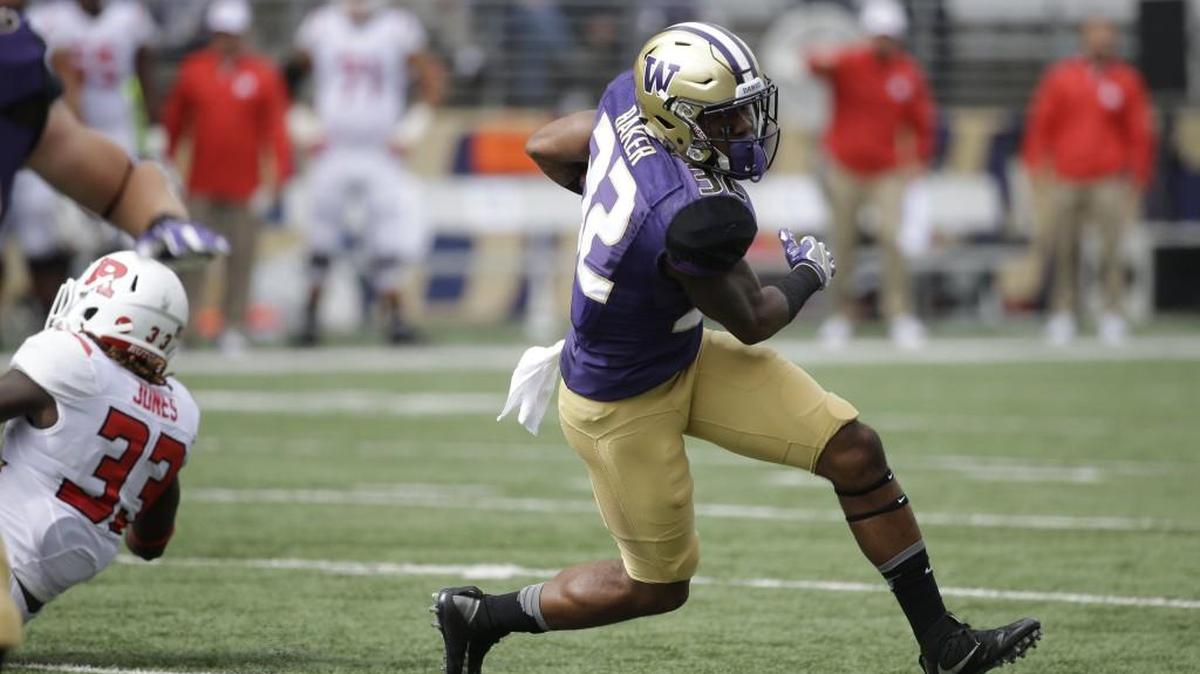 Washington’s Budda Baker runs against Rutgers in the first half of an NCAA college football game Saturday, Sept. 3, 2016, in Seattle.