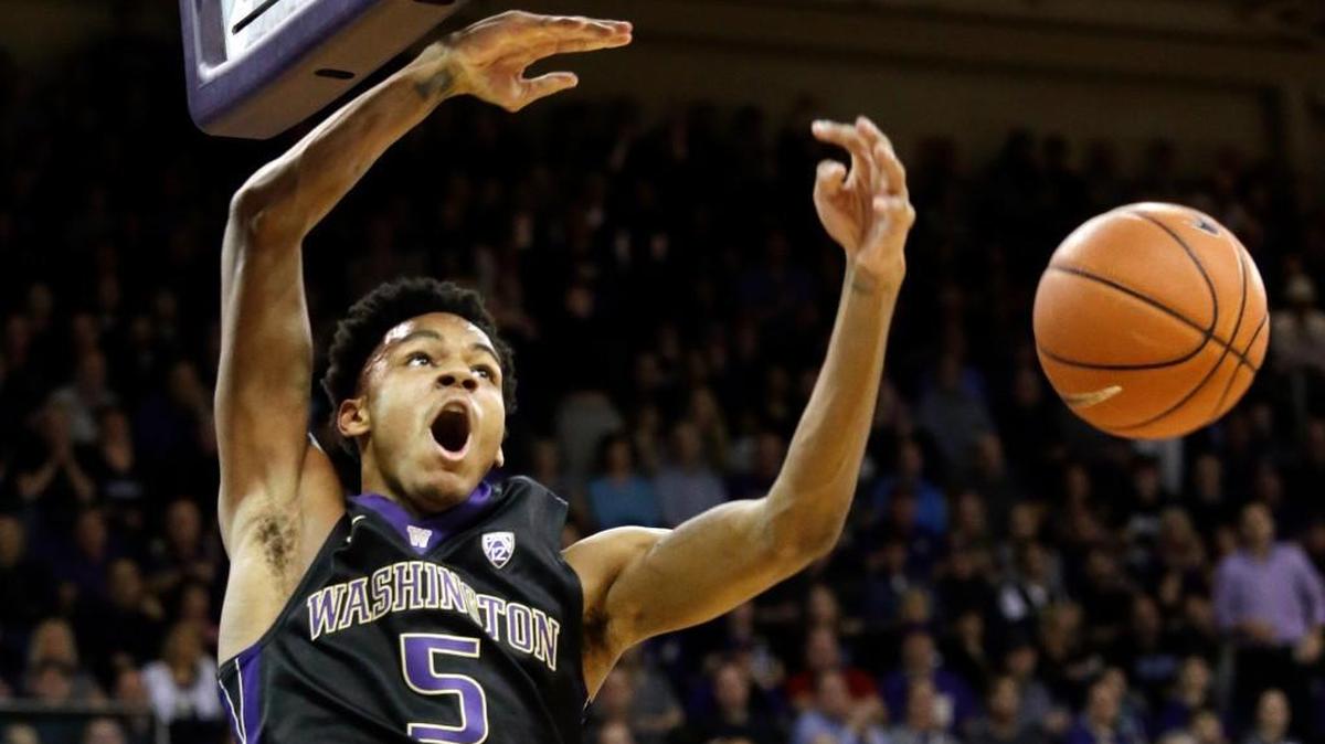 Washington's Dejounte Murray reacts after dunking against California during the first half of an NCAA college basketball game Thursday, Feb. 18, 2016, in Seattle.