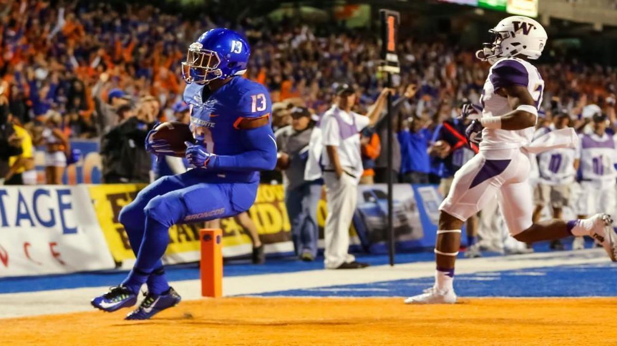 
Boise State running back Jeremy McNichols scores a first-half touchdown Friday. The Broncos ran roughshod in the first half, before the Washington defense settled down in the second half.
