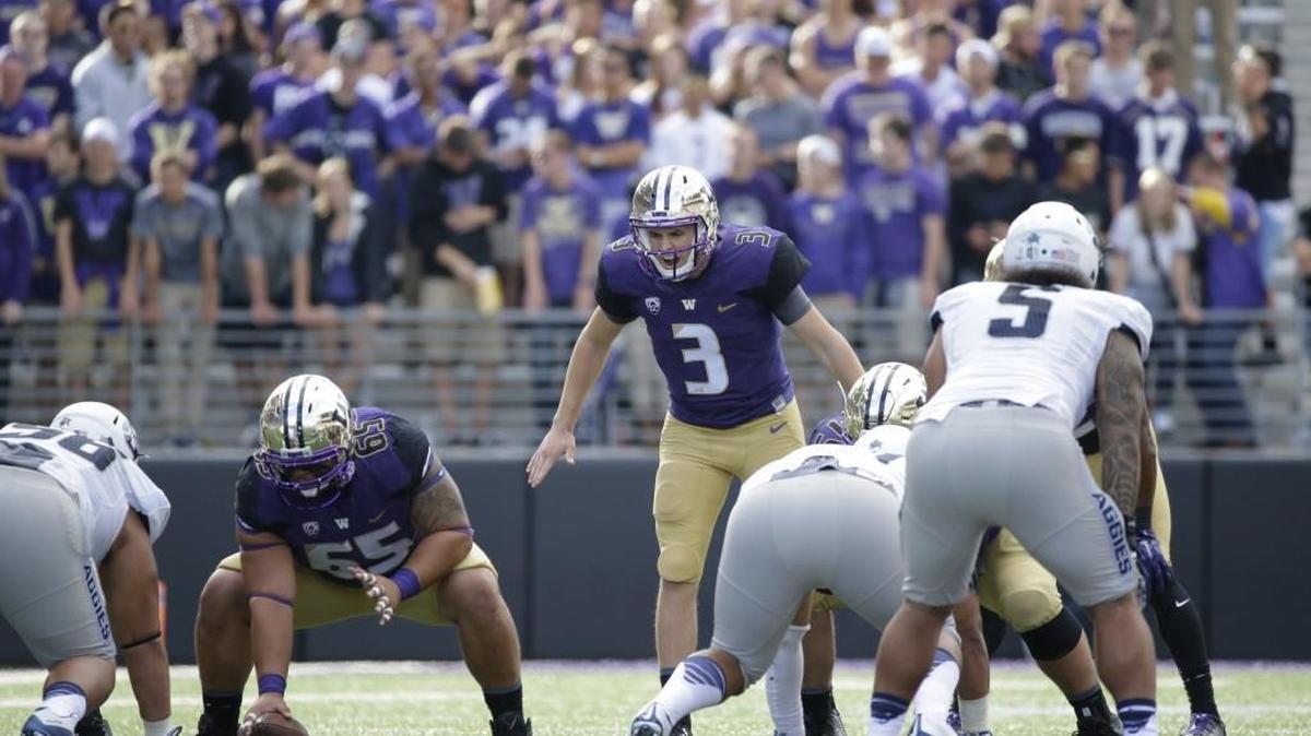 
Washington quarterback Jake Browning (3) on the line of scrimmage against Utah State in the second half of an NCAA college football game, Saturday, Sept. 19, 2015, in Seattle. Washington beat Utah State 31-17.
