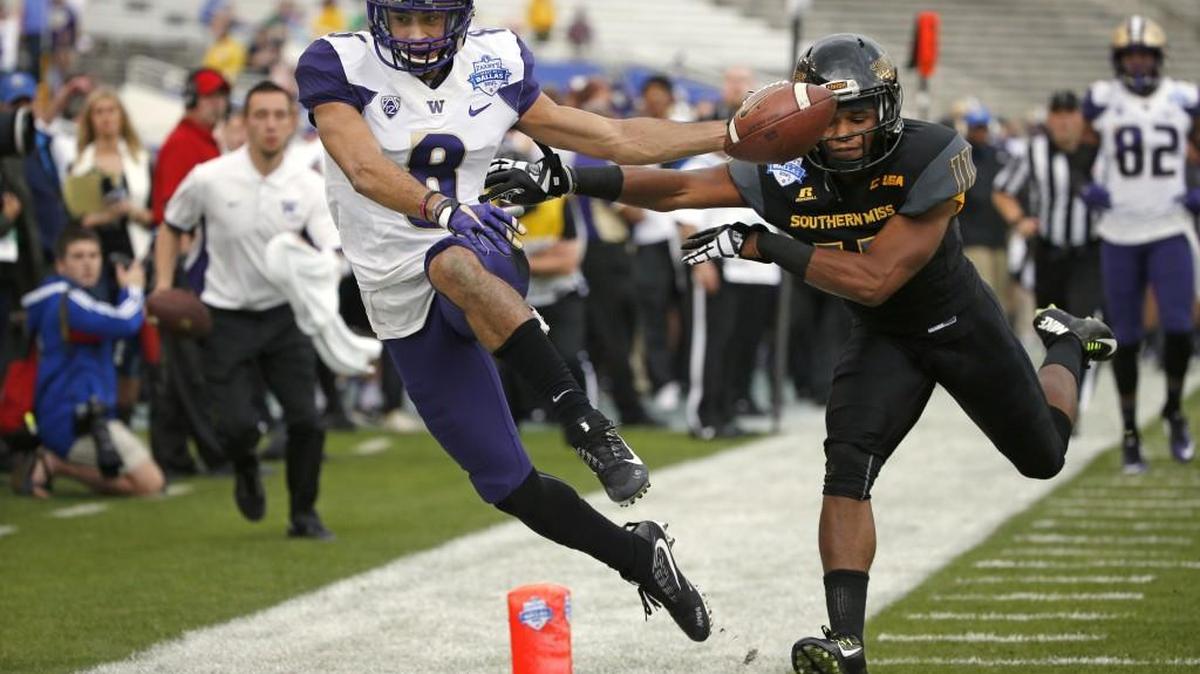 Washington wide receiver Dante Pettis (8) takes the ball inside the five yard line against Southern Mississippi defensive back Kalan Reed (11) during the first half of the Heart of Dallas Bowl NCAA college football game, Saturday, Dec. 26, 2015, in Dallas. (AP Photo/Ron Jenkins)
