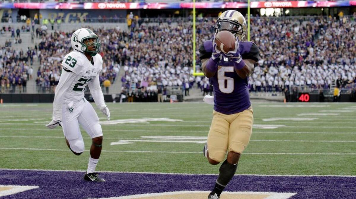 UW’s Chico McClatcher (6) outraces Portland State’s Montre Brown to the end zone, catching a first-half touchdown pass Saturday. McClatcher made two scoring receptions before halftime, and finished with four catches for 69 yards. He picked up 37 yards rushing on three carries.