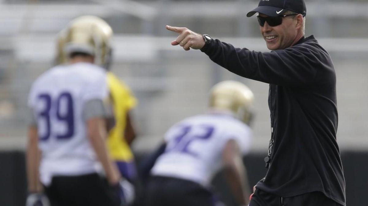 Washington coach Chris Petersen, seen here at a March practice, received a two-year contract extension Thursday at $4 million per season.