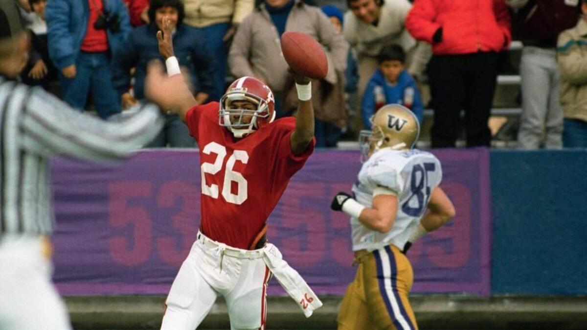 Bobby Humphrey scores a touchdown — one of his three of the day — against Washington during the first quarter of the Sun Bowl in 1986.