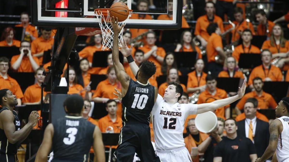Colorado’s Tre’Shaun Fletcher (10) shoots over Oregon State's Drew Eubanks (12) in a game Feb. 6. Fletcher also played high school basketball for Lincoln.