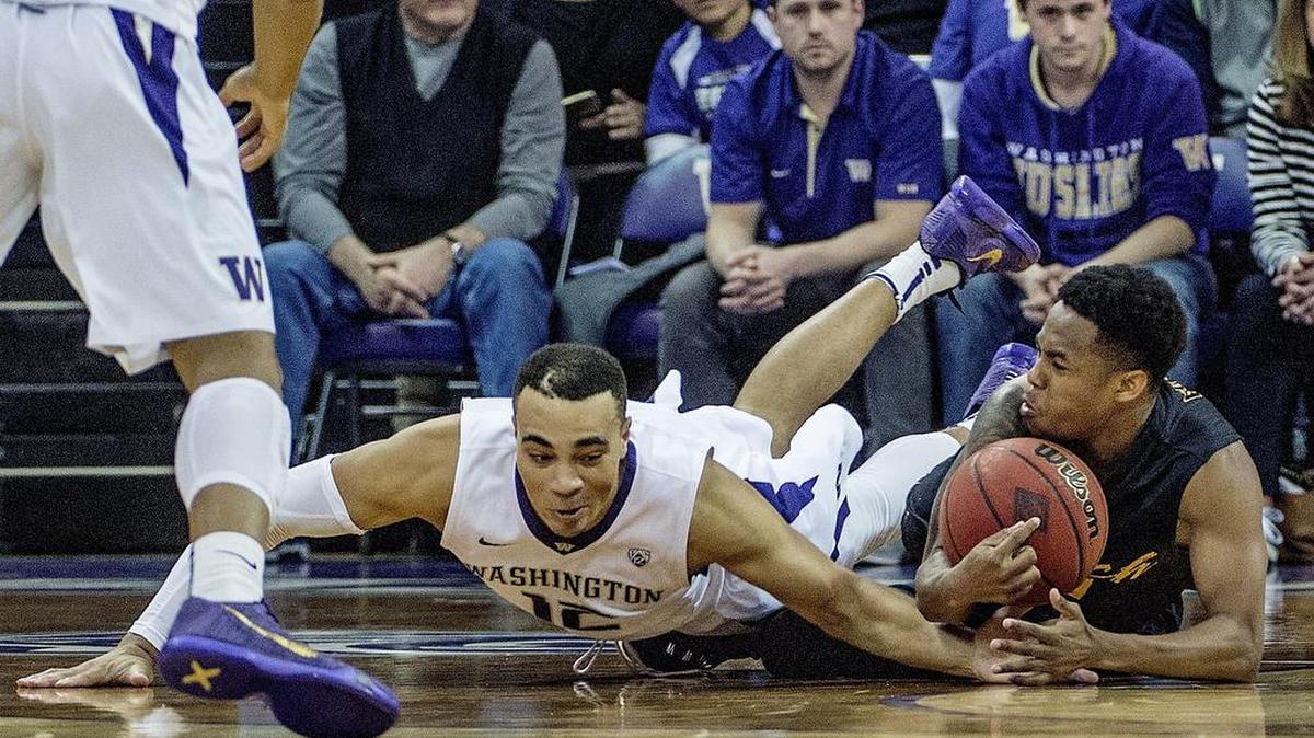 UW’s Andrew Andrews dives for a lose ball against Long Beach State Tuesday 03/1516 a NIT first round game between the UW and Long Beach State at Hec Ed. Arena won by the Huskies 107-102.