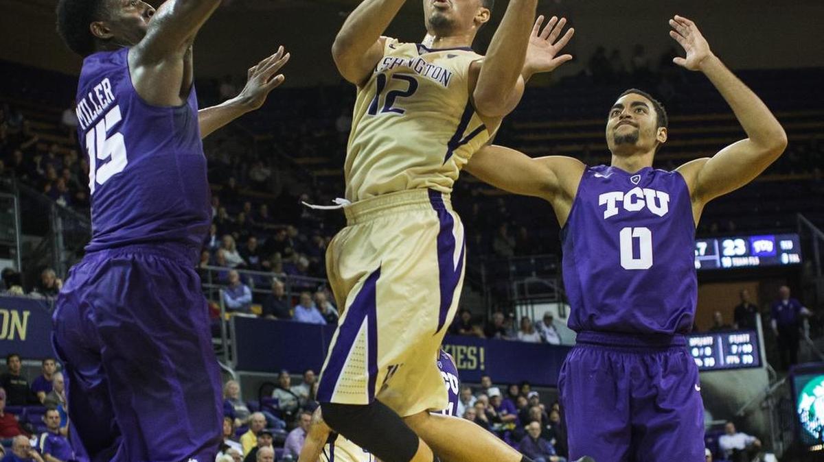 Washington’s Andrew Andrews (12) goes up for a basket against TCU on Tuesday night. Andrews scored a game-high 32 points and was 6 for 6 from 3-point range.