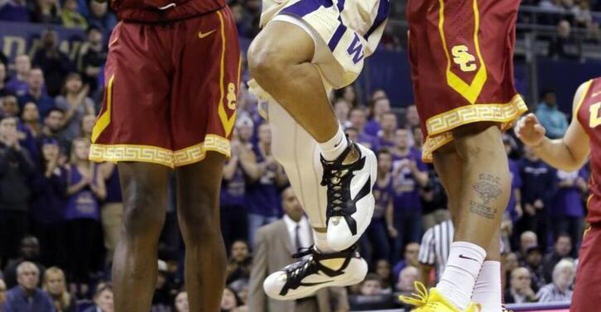 Washington’s Andrew Andrews, center, shoots between a pair of Southern California defenders earlier this month. The Huskies erased a 22-point deficit to win that game against the Trojans. UW plays at UCLA on Thursday and USC on Sunday.
