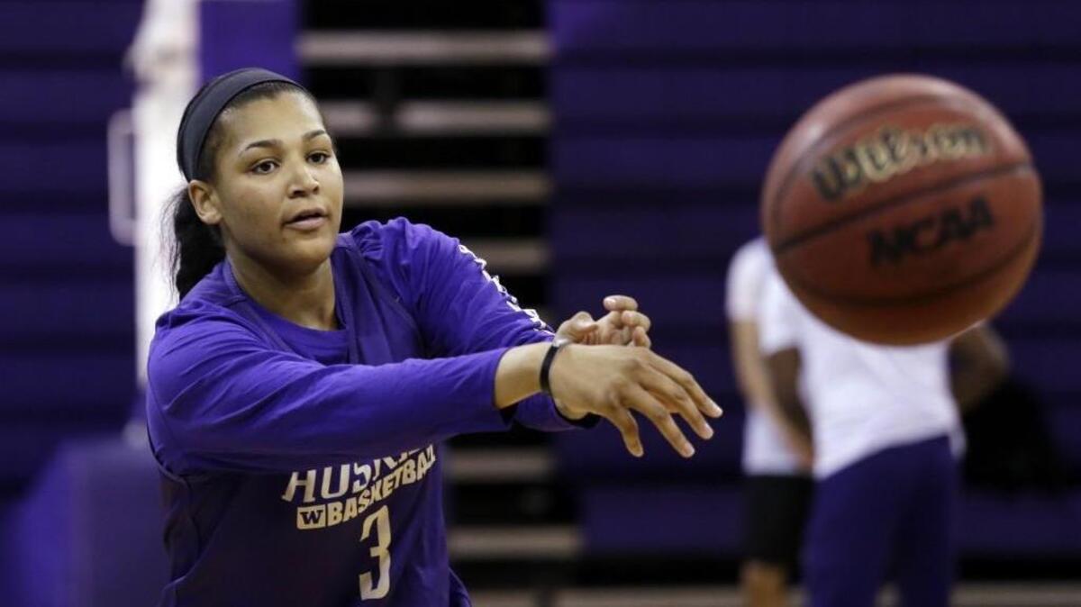 Washington’s Talia Walton passes during a basketball practice March 29. Walton, who averaged 16.5 points and 6.4 rebounds per game last season, is the highest-drafted player in UW women’s basketball history