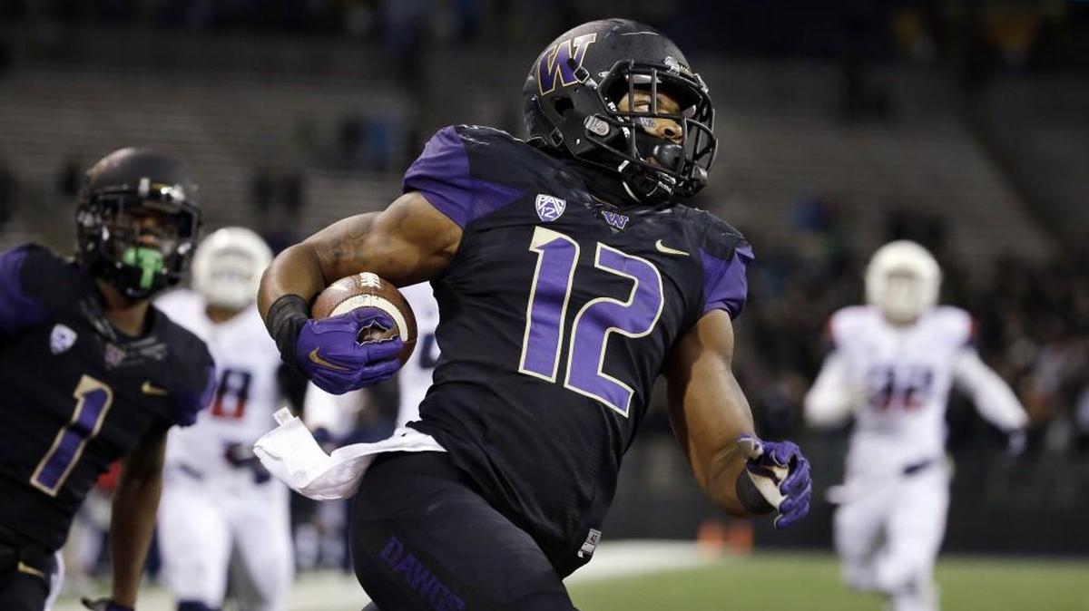 Washington fullback Dwayne Washington scores on a 69-yard run against Arizona during the second half on Oct. 31, 2015, in Seattle. Washington was selected by the Detroit Lions on Saturday with the 236th overall pick in the seventh round of the NFL draft.