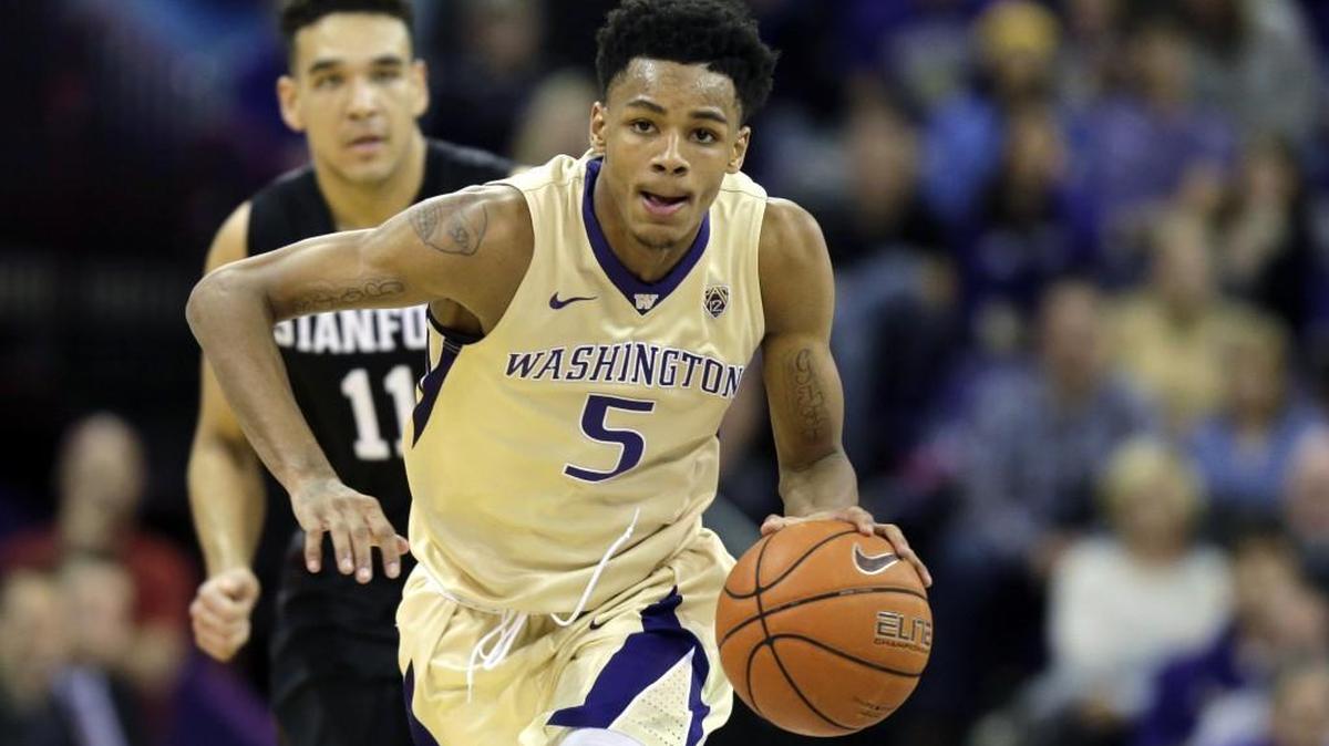 Washington guard Dejounte Murray drives down the court against Stanford during an NCAA college basketball game, Saturday, Feb. 20, 2016, in Seattle.