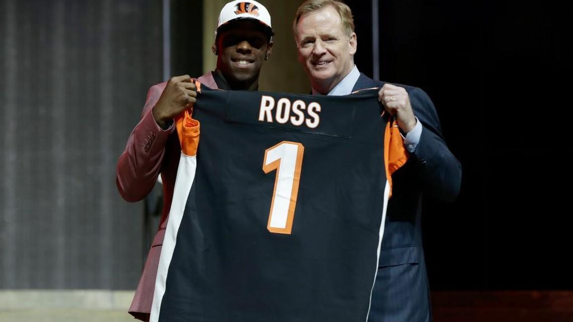 Washington’s John Ross, left, poses with NFL commissioner Roger Goodell after being selected by the Cincinnati Bengals on Thursday during the first round of the 2017 NFLdraft in Philadelphia.