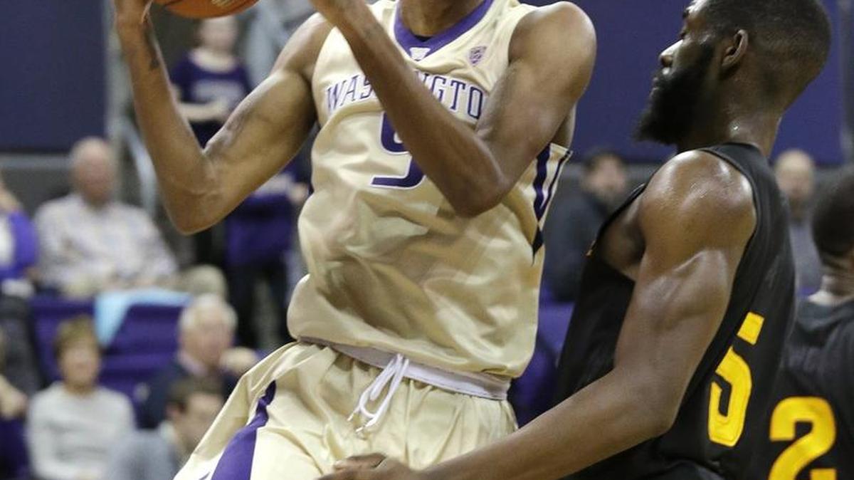 Dejounte Murray, left, scored 34 points in the Huskies’ 95-83 overtime win over Arizona State this past Wednesday.