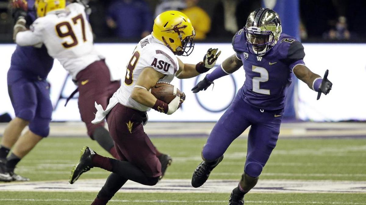 
Arizona State’s Jordan Simone (38), returning an interception last season against Kasen Williams and the Washington Huskies, was a walk-on at Washington State after graduating from Skyline High School in Sammamish.
