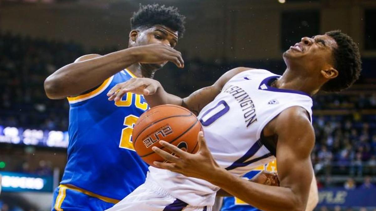 Washington forward Marquese Chriss (0) reacts after being fouled by UCLA forward Tony Parker (23) in the Huskies’ 99-93 double-overtime win over the Bruins on Friday.