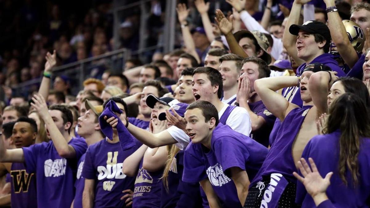 Washington students seated in the “Dawg Pack” section react to a call in favor of Arizona on Saturday during the second half in Seattle. Prized signee Markelle Fultz was on hand to watch and received a loud ovation when shown on the video scoreboard.