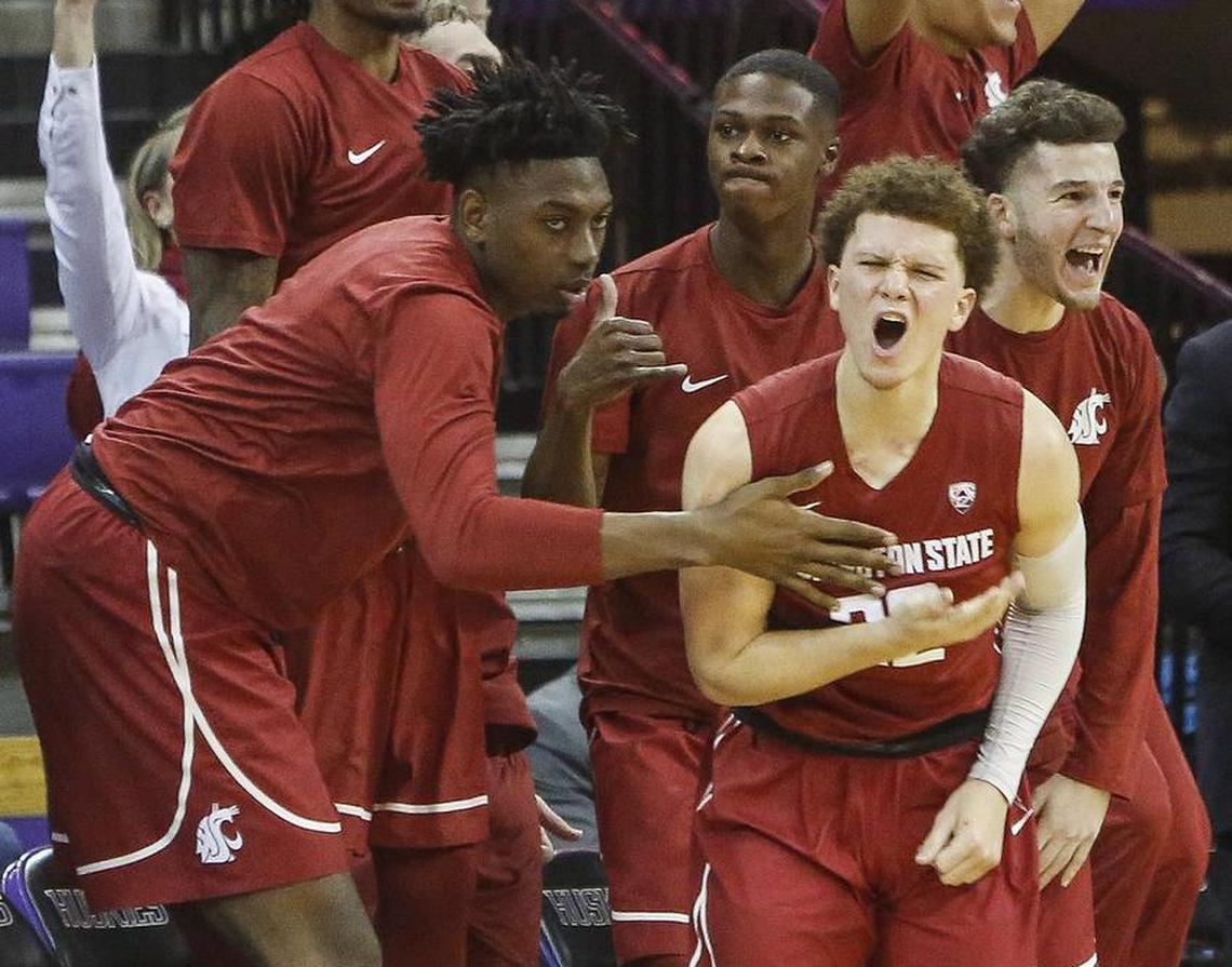 Players celebrate after a three-point-shot by Washington State guard Malachi Flynn (22) in the second half. The Washington Huskies played the Washington State Cougars in a basketball game at Hec Edmundson Pavilion in Seattle, Wash., on Sunday, January 1, 2017.