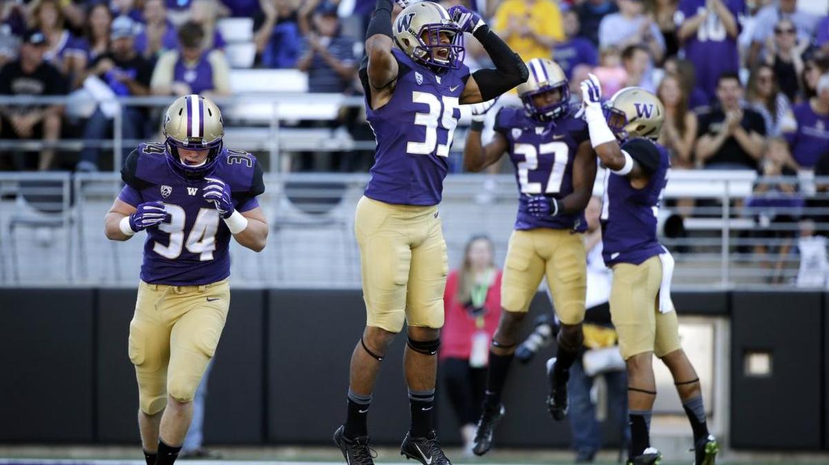 
Washington’s Brian Clay (35), a candidate to start at strong safety for the Huskies, missed a few practices recently to work on his master’s degree.
