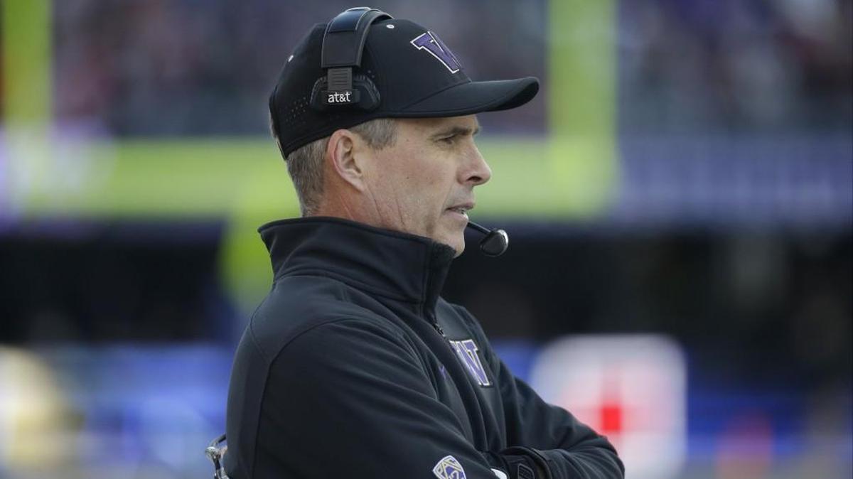 Washington head coach Chris Petersen stands on the sidelines before the Apple Cup Nov. 27 against Washington State.