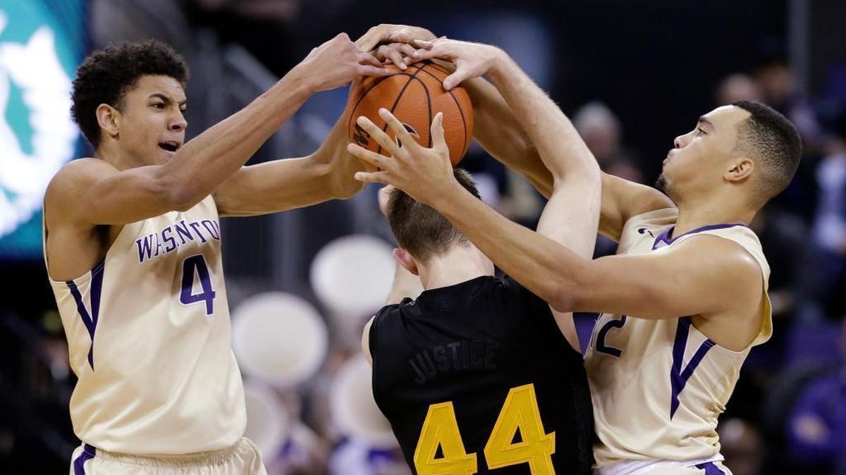 Washington's Matisse Thybulle (4) and Andrew Andrews double-team and try to steal the ball from Arizona State's Kodi Justice (44) during the first half of an NCAA college basketball game Wednesday, Feb. 3, 2016, in Seattle. Justice kept possession.