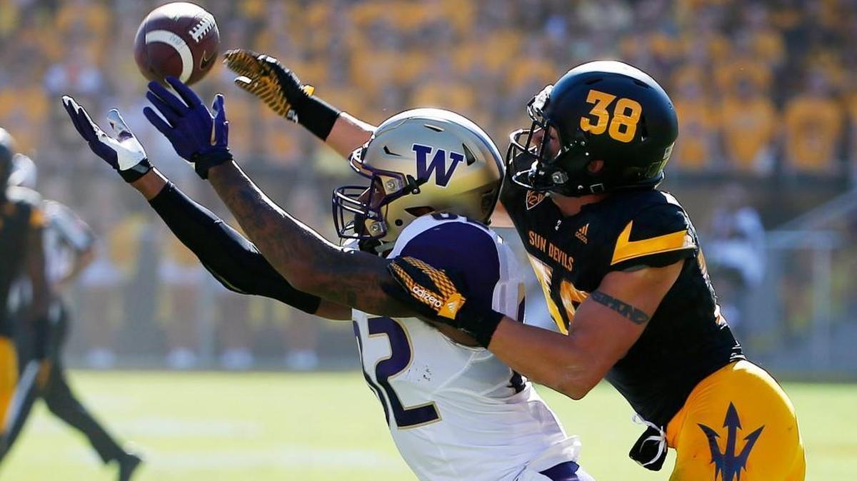Arizona State's Jordan Simone (38) tips a pass away from Washington's Joshua Perkins, left, during the first half of an NCAA college football game Saturday, Nov. 14, 2015, in Tempe, Ariz.