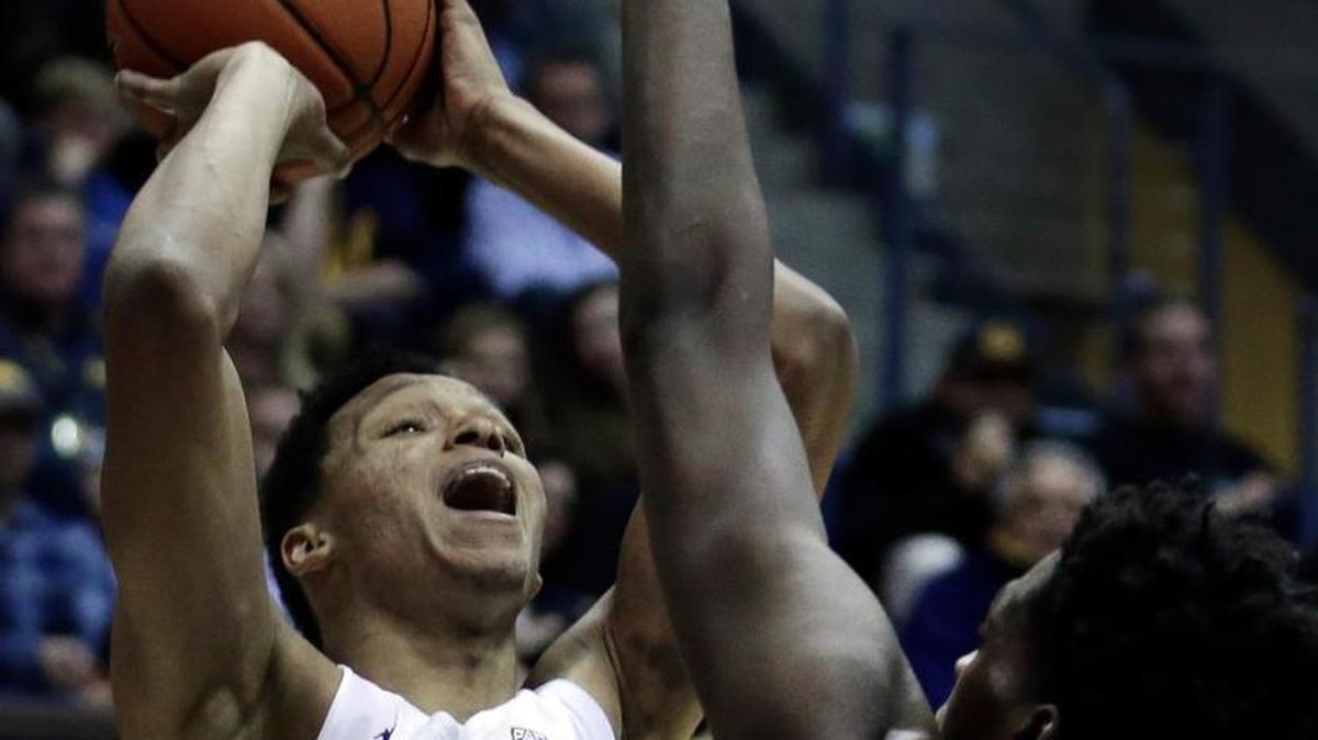 California’s Ivan Rabb, left, shoots over Washington's Noah Dickerson (15) in the second half Thursday in Berkeley, Calif. Rabb finished with 20 points and 14 rebounds in Cal’s 69-59 victory over the Huskies.