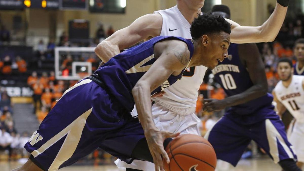 Washington’s Dejounte Murray, front, tries to get to the basket while being guarded by Oregon State’s Tres Tinkle during the first half Wednesday night.
