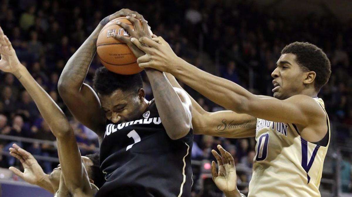 Colorado’s Wesley Gordon, left, battles Washington’s Marquese Chriss for the ball Jan. 20 in the first half at the Hec Edmundson Pavilion. Chriss had one of his best games with the Huskies, scoring 17 points, grabbing six rebounds and blocking five shots before fouling out in the final minute.