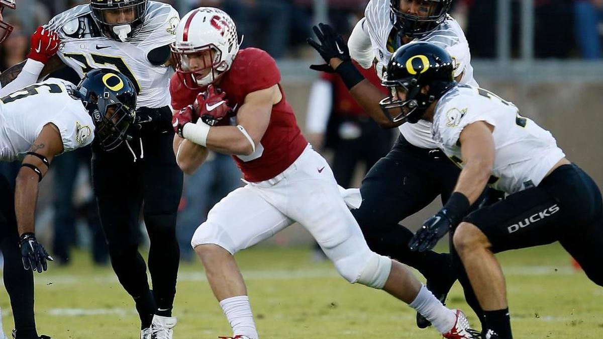 Stanford running back Christian McCaffrey (5) runs the ball past the Oregon defensive line in Stanford, Calif. Last season, Oregon won the head-to-head meeting and probably spoiled Stanford’s playoff hopes, though the Cardinal still went on to win the conference.