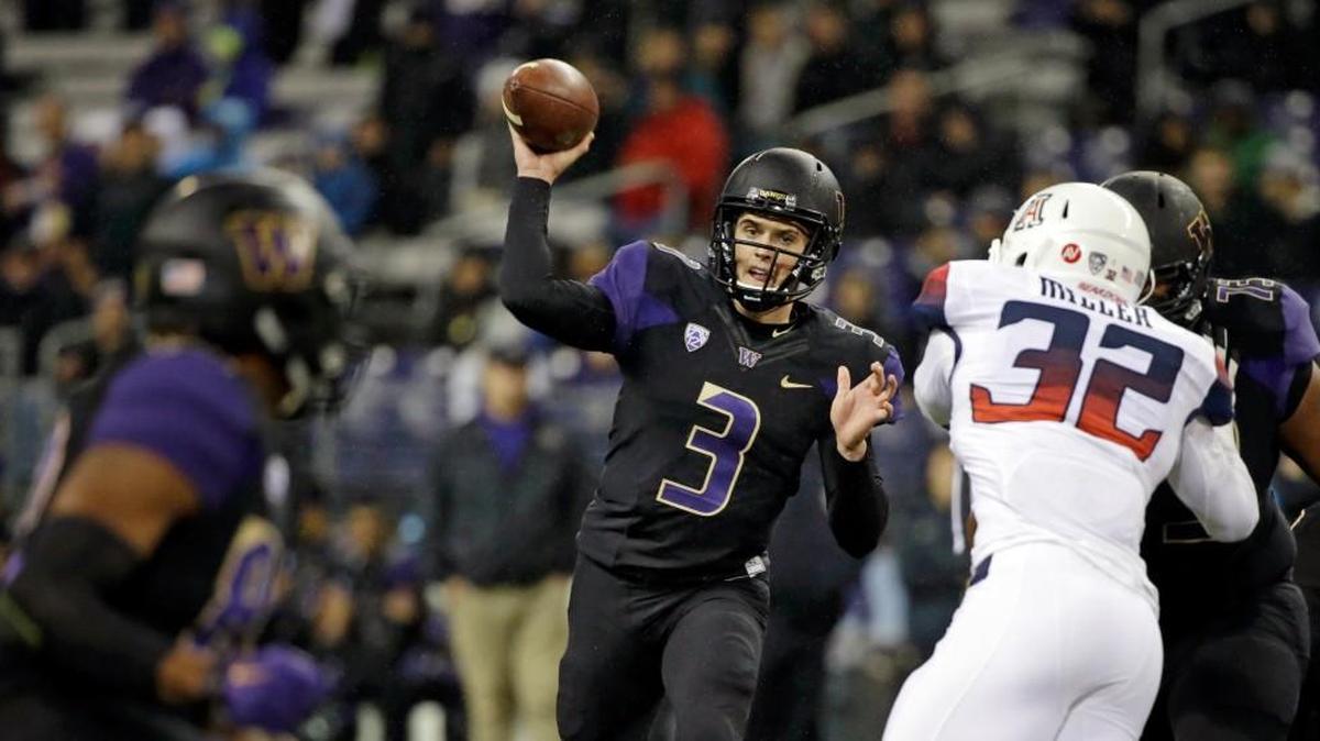 Washington quarterback Jake Browning (3) throws a touchdown pass to Joshua Perkins, left, against Arizona in the first half an NCAA college football game Saturday, Oct. 31, 2015, in Seattle.
