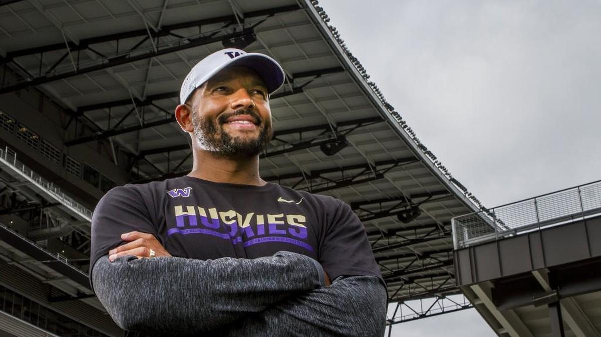 Jimmy Lake, University of Washington defensive backs coach, stands for a portrait outside Husky Stadium in Seattle.